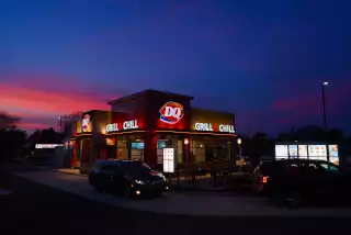 North Anthony Dairy Queen, twilight, east view, with cars in drive-thru